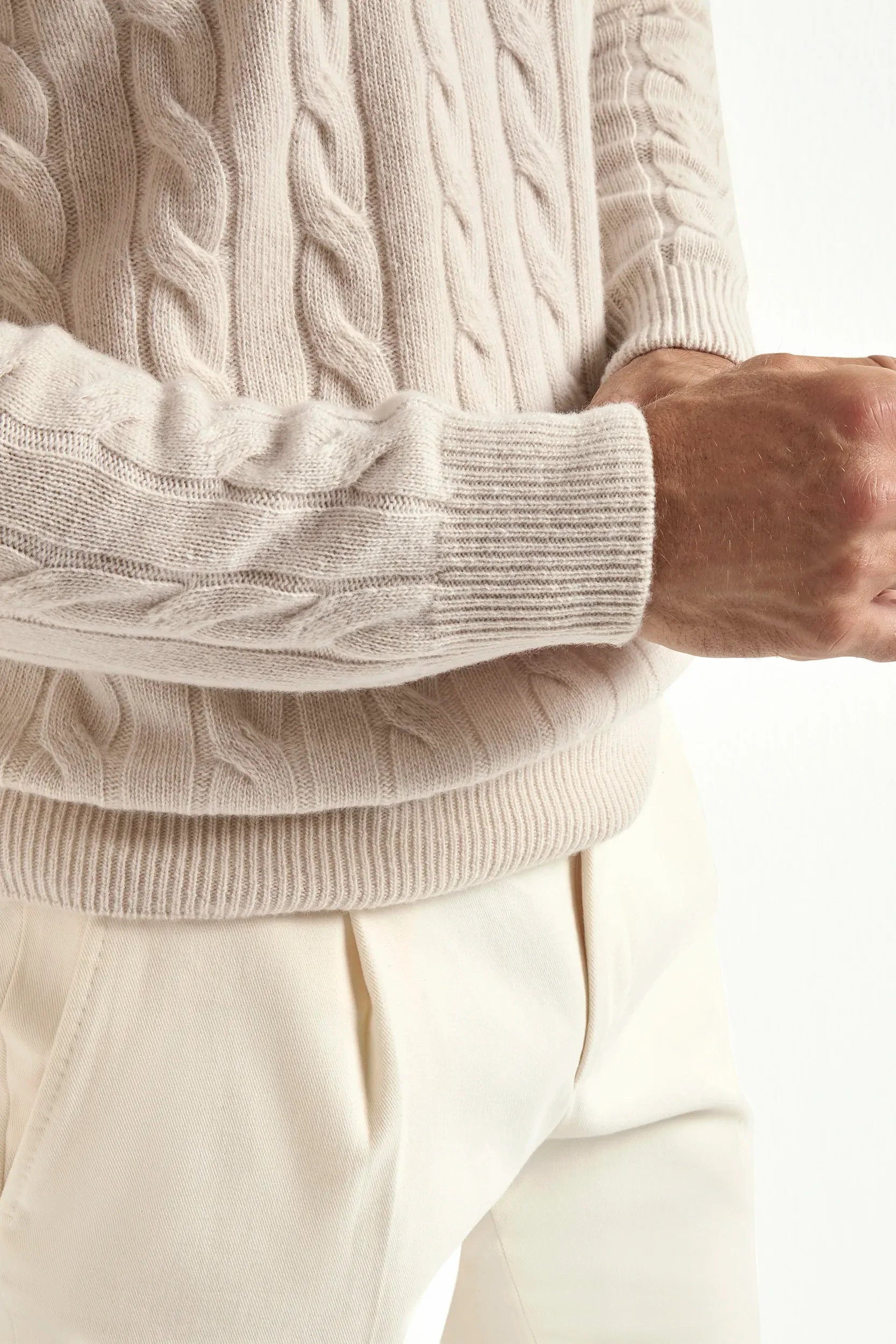 Beige cable-knit turtleneck sweater