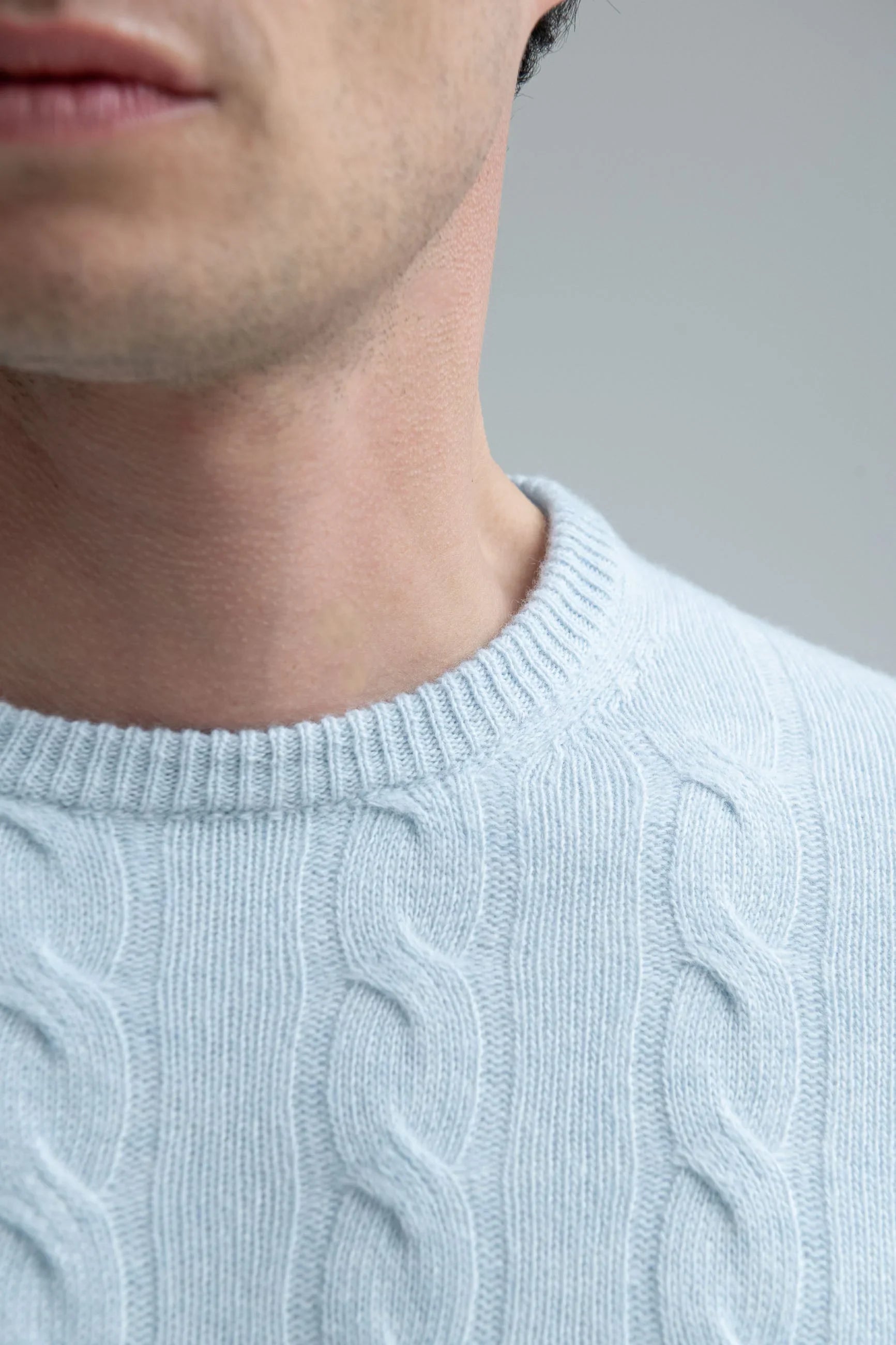 Light blue cable-knit sweater