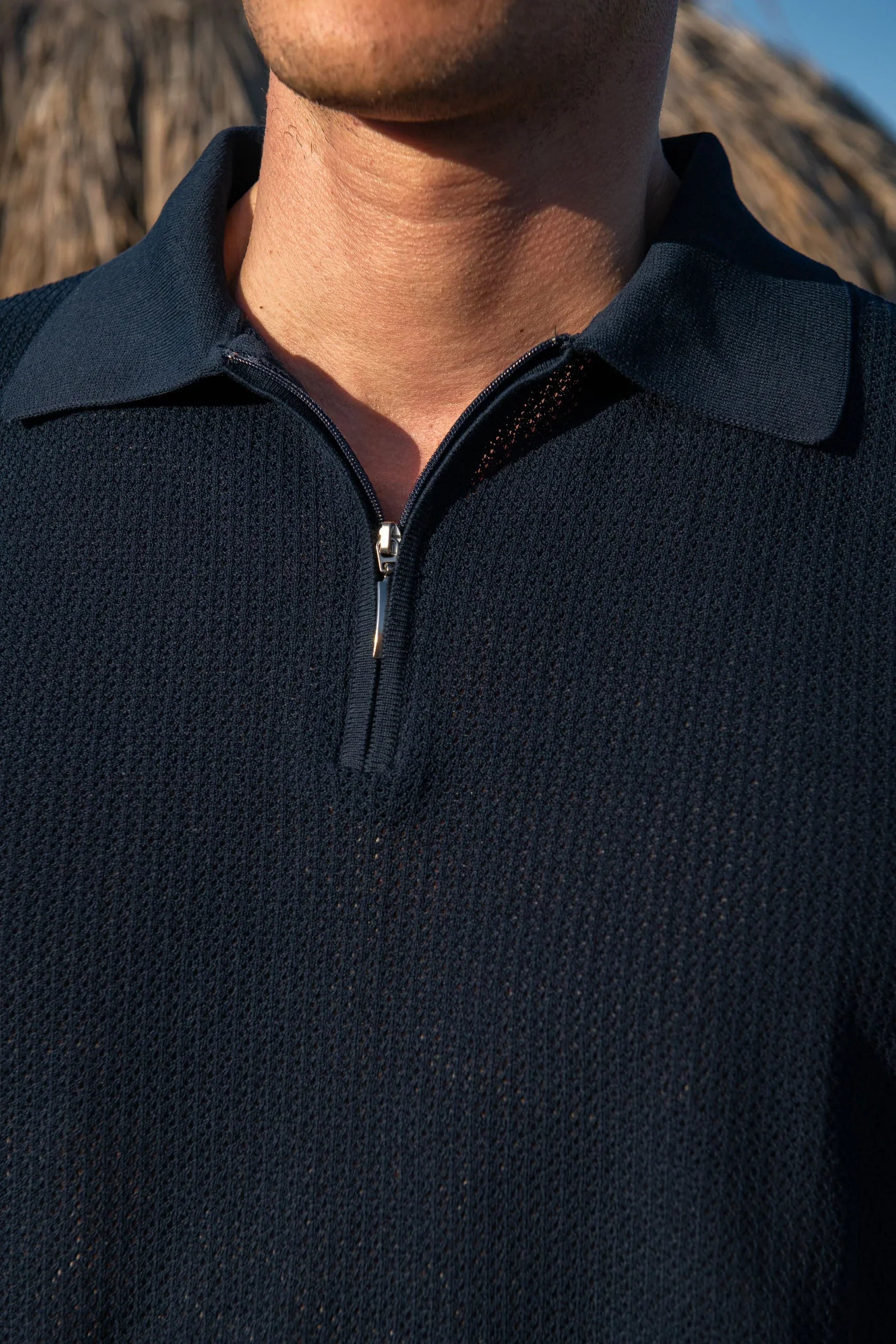 Polo shirt in blue textured knit with zip