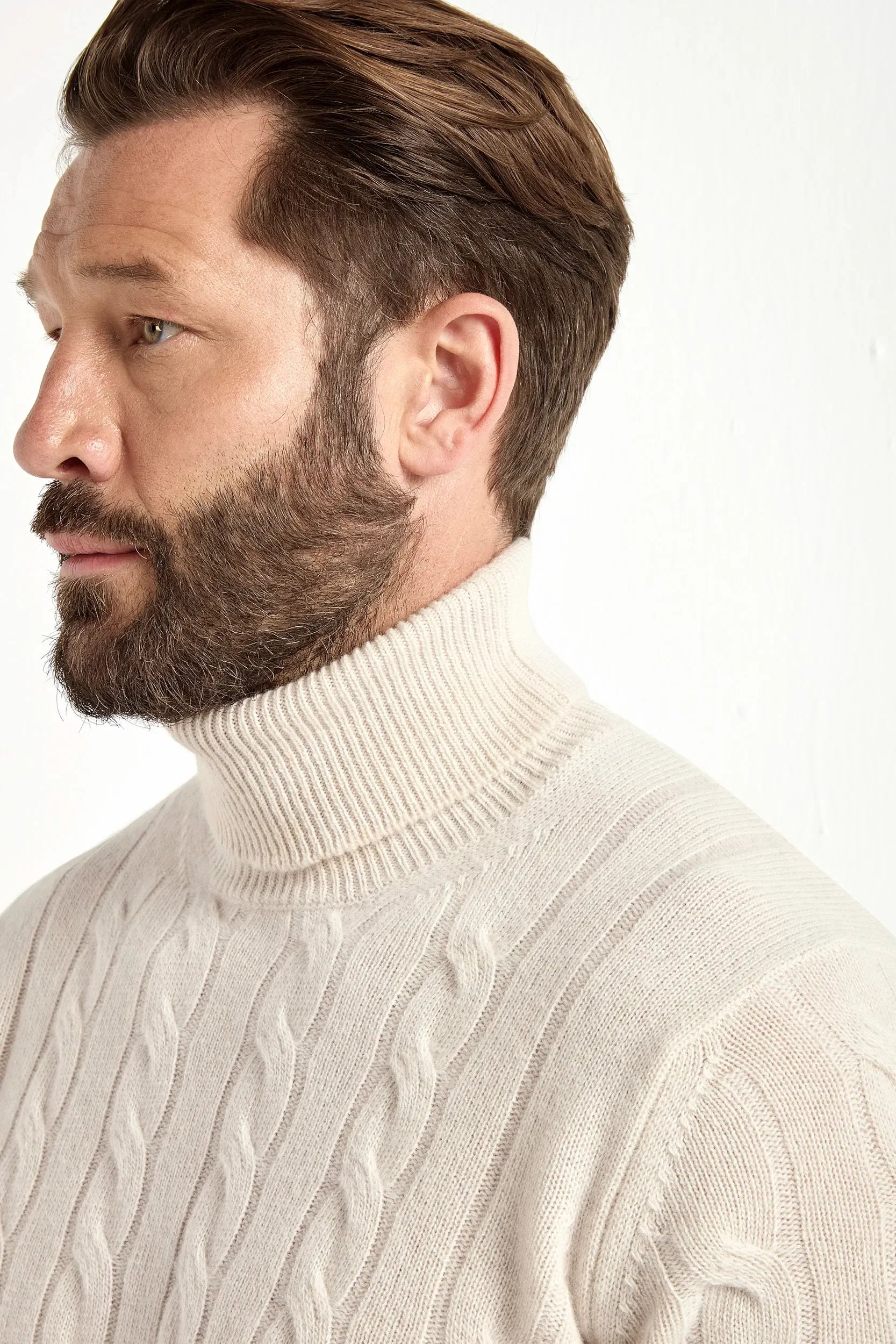 Beige cable-knit turtleneck sweater