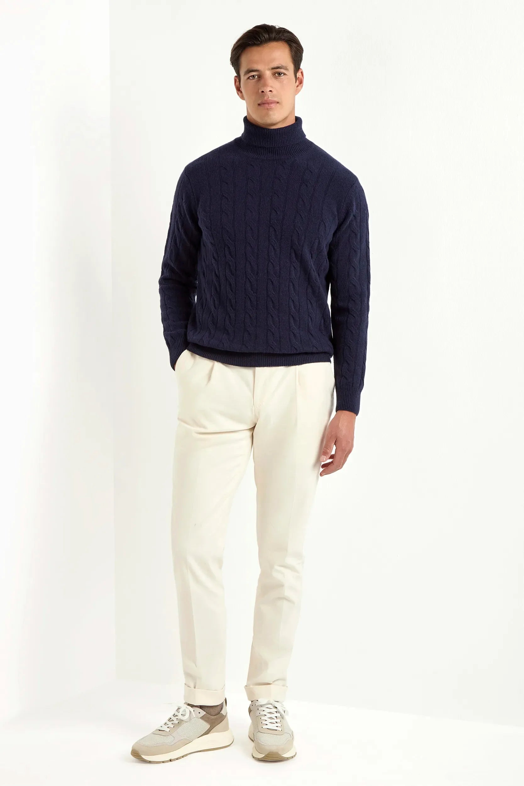 Blue cable-knit turtleneck sweater