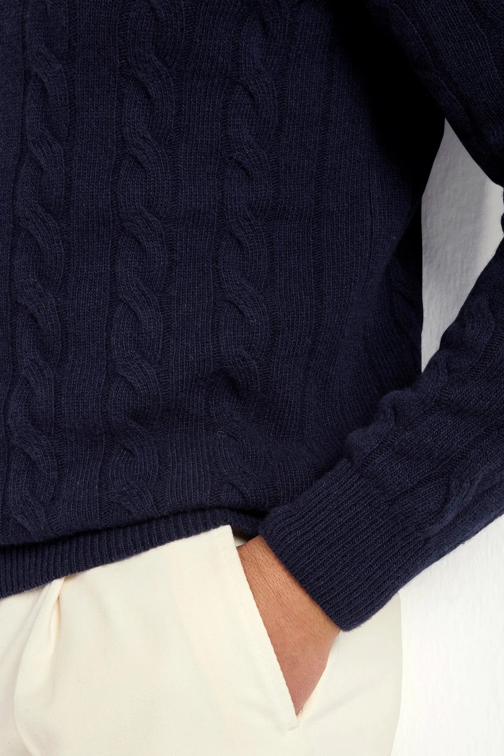 Blue cable-knit turtleneck sweater