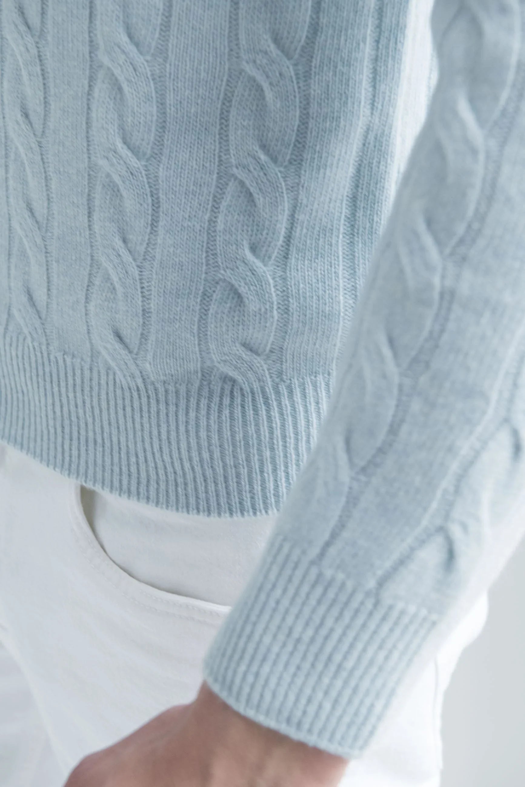 Light blue cable-knit sweater