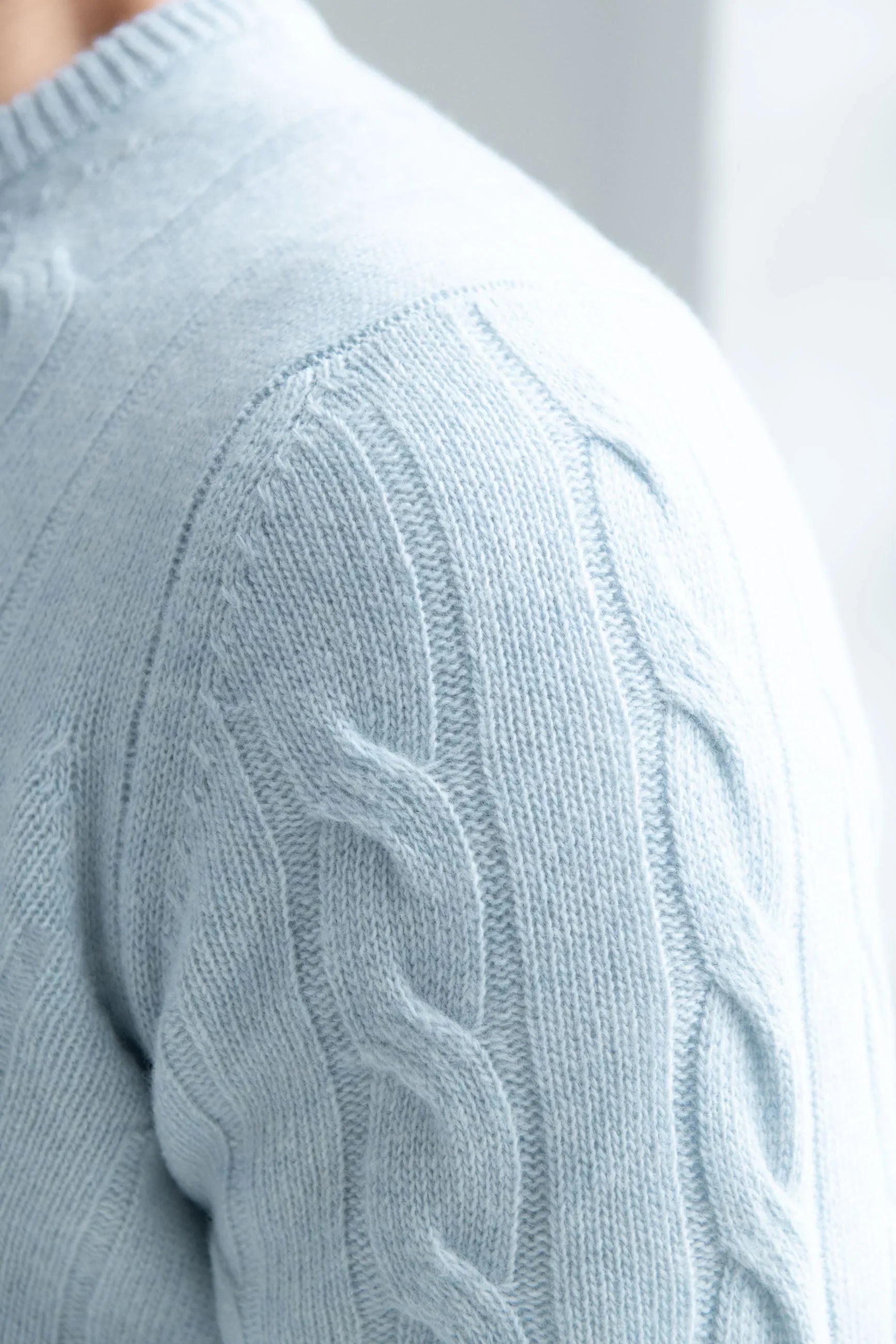 Light blue cable-knit sweater