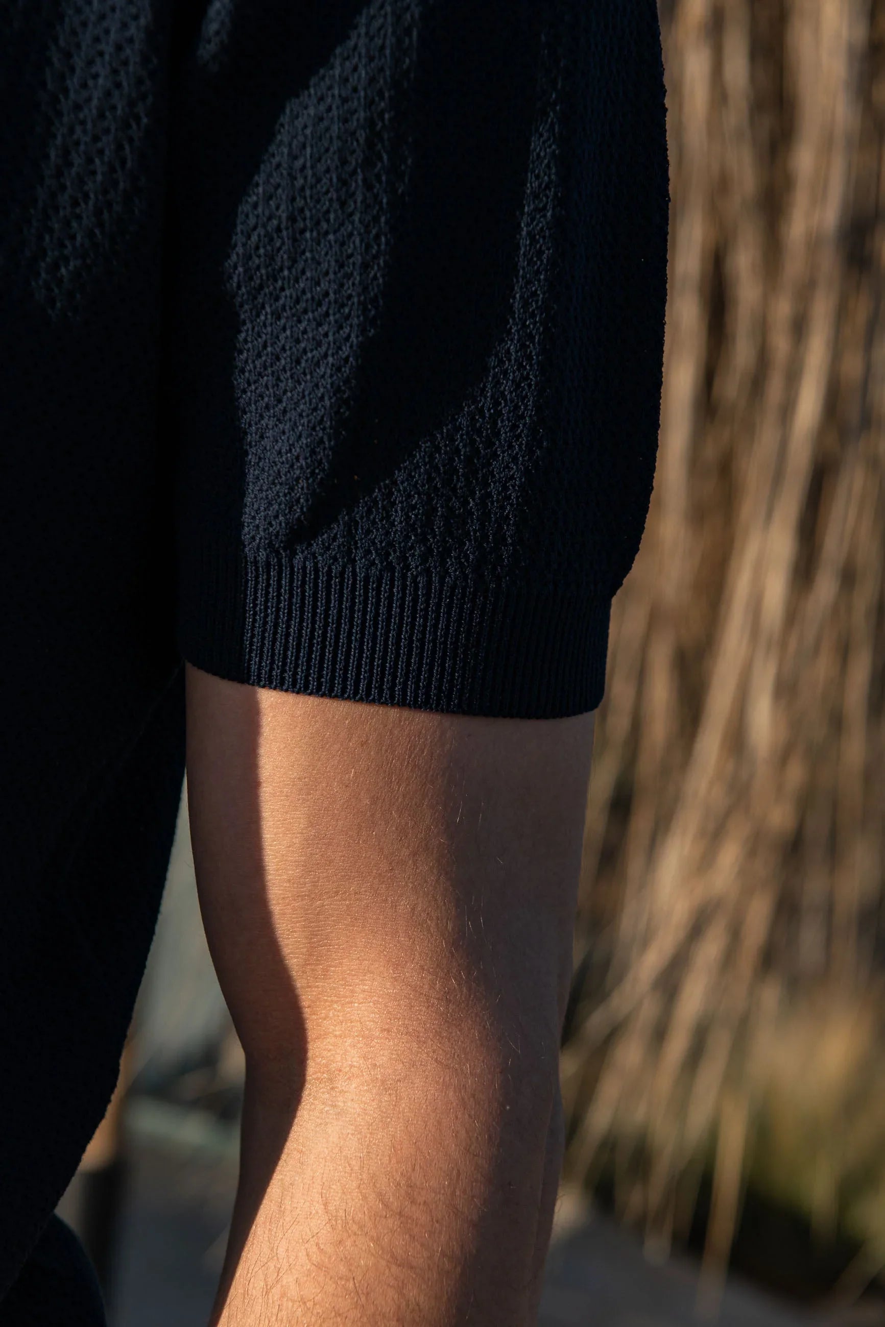 Polo shirt in blue textured knit with zip